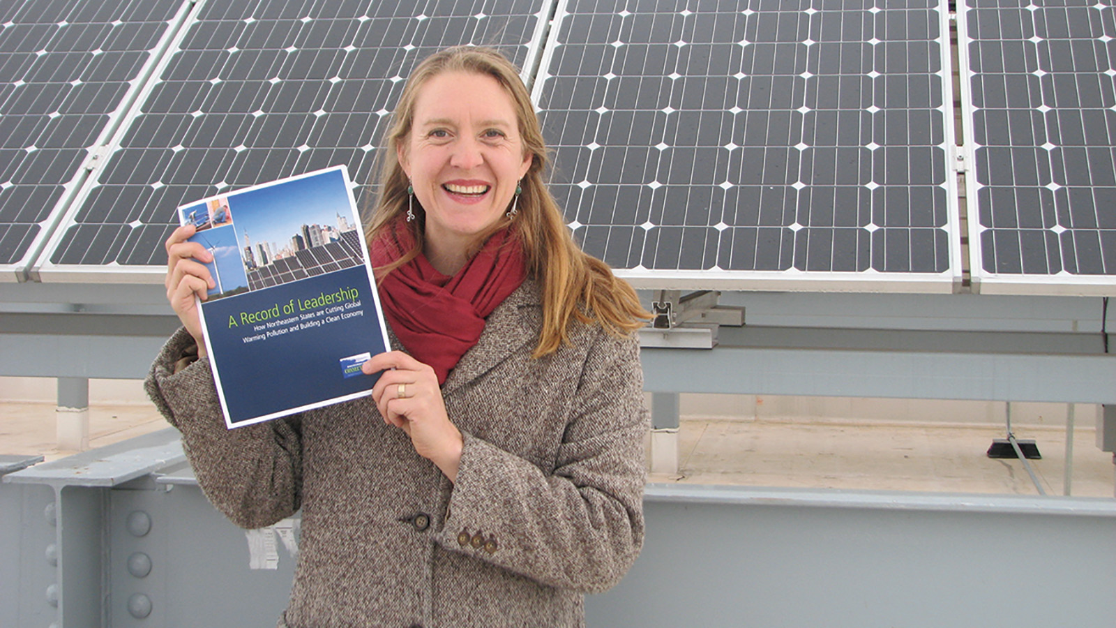 Johanna Neumann in front of solar panels