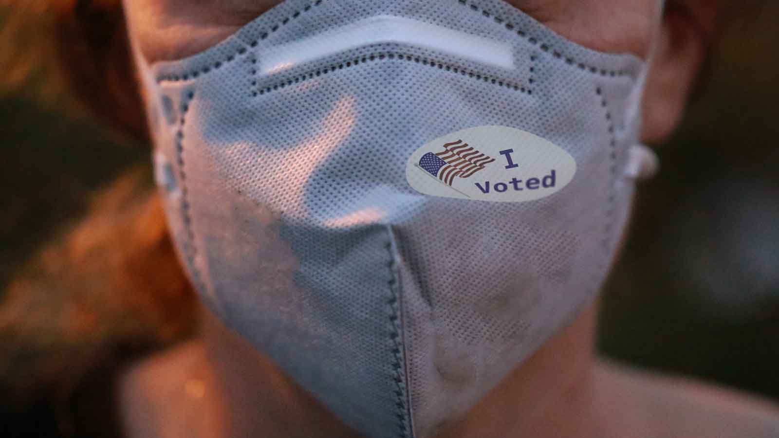 Mask with I Voted sticker