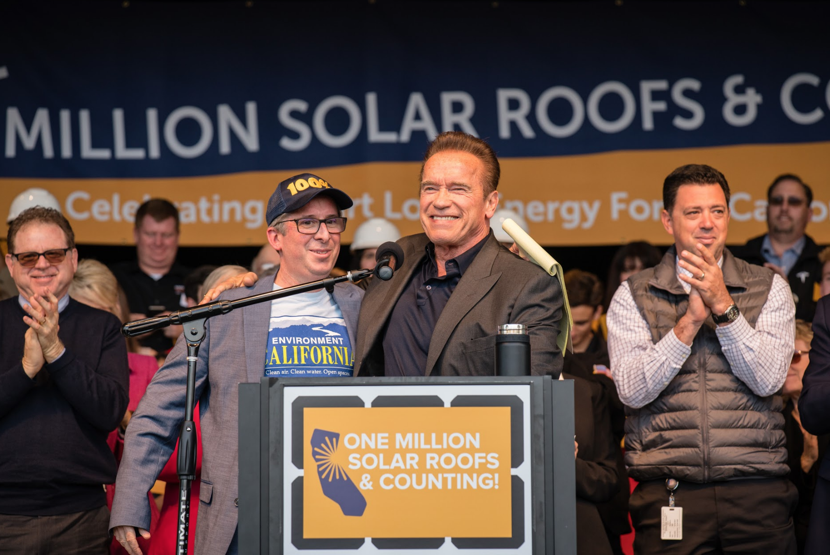 Environment California's Dan Jacobson celebrates reaching the Million Solar Roofs milestone alongside former Governor Schwarzenegger (photo credit: Tomas Ovalle)