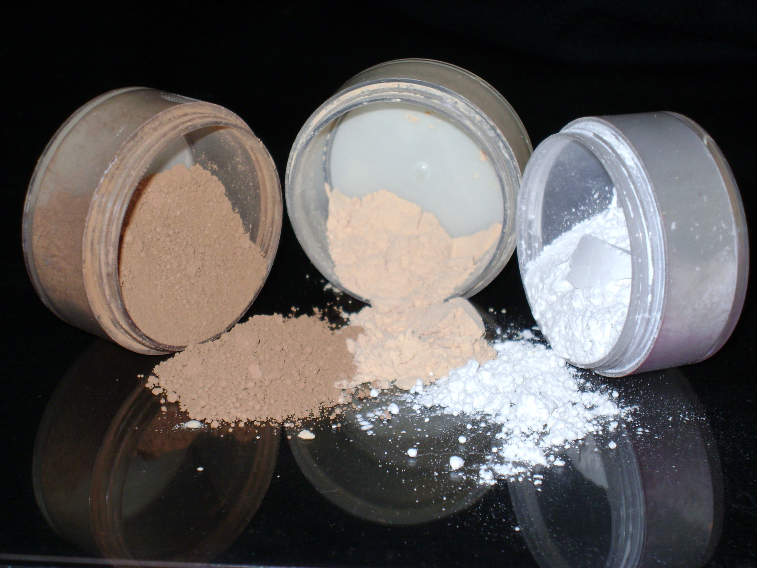 Three containers of powdery makeup CC via Wikimedia Commons