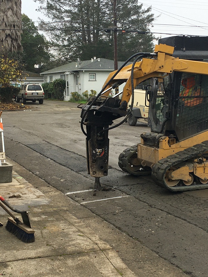 Jackhammer removing asphalt