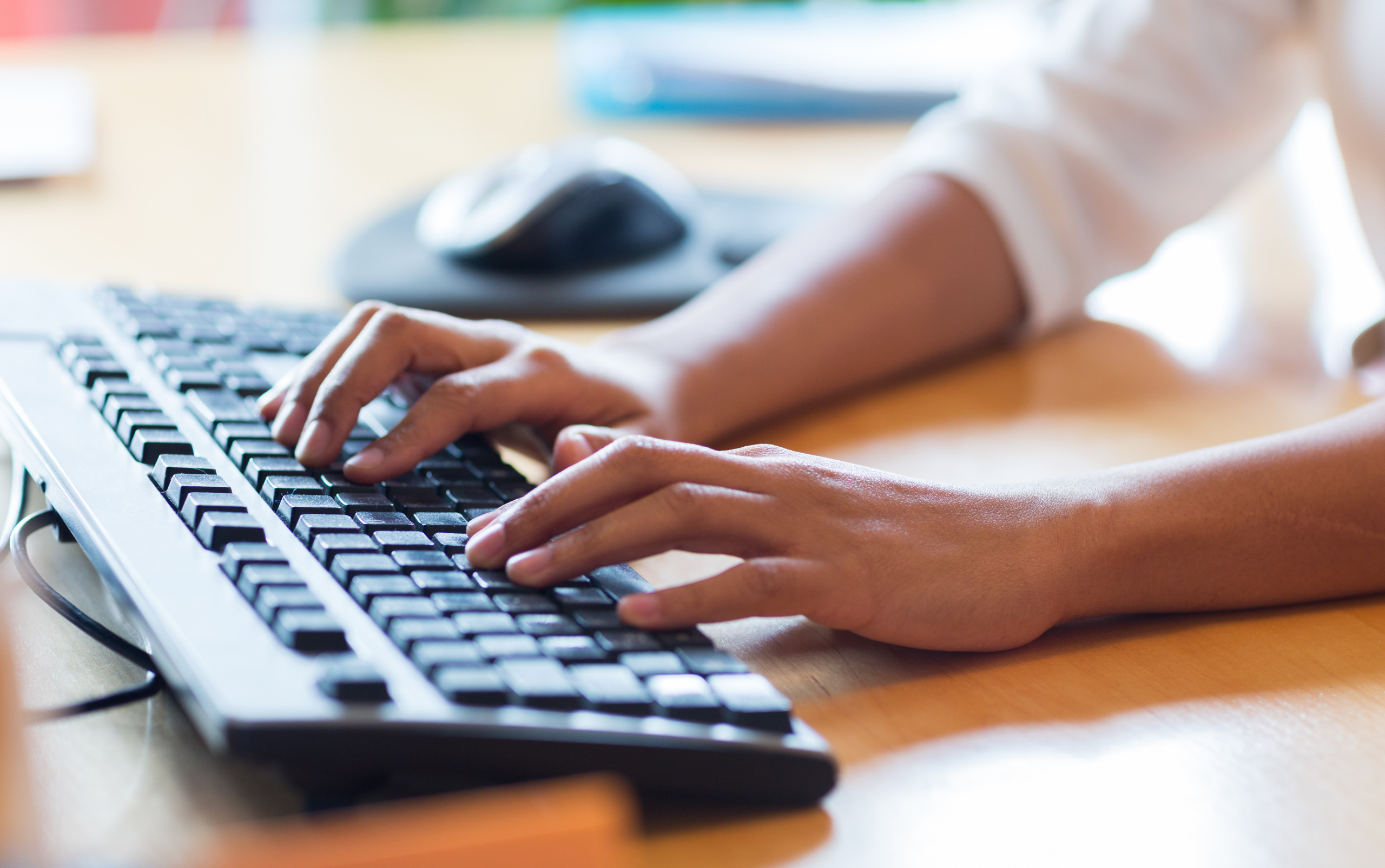 hands-typing-on-keyboard-Syda-Production-Adobe-Stock