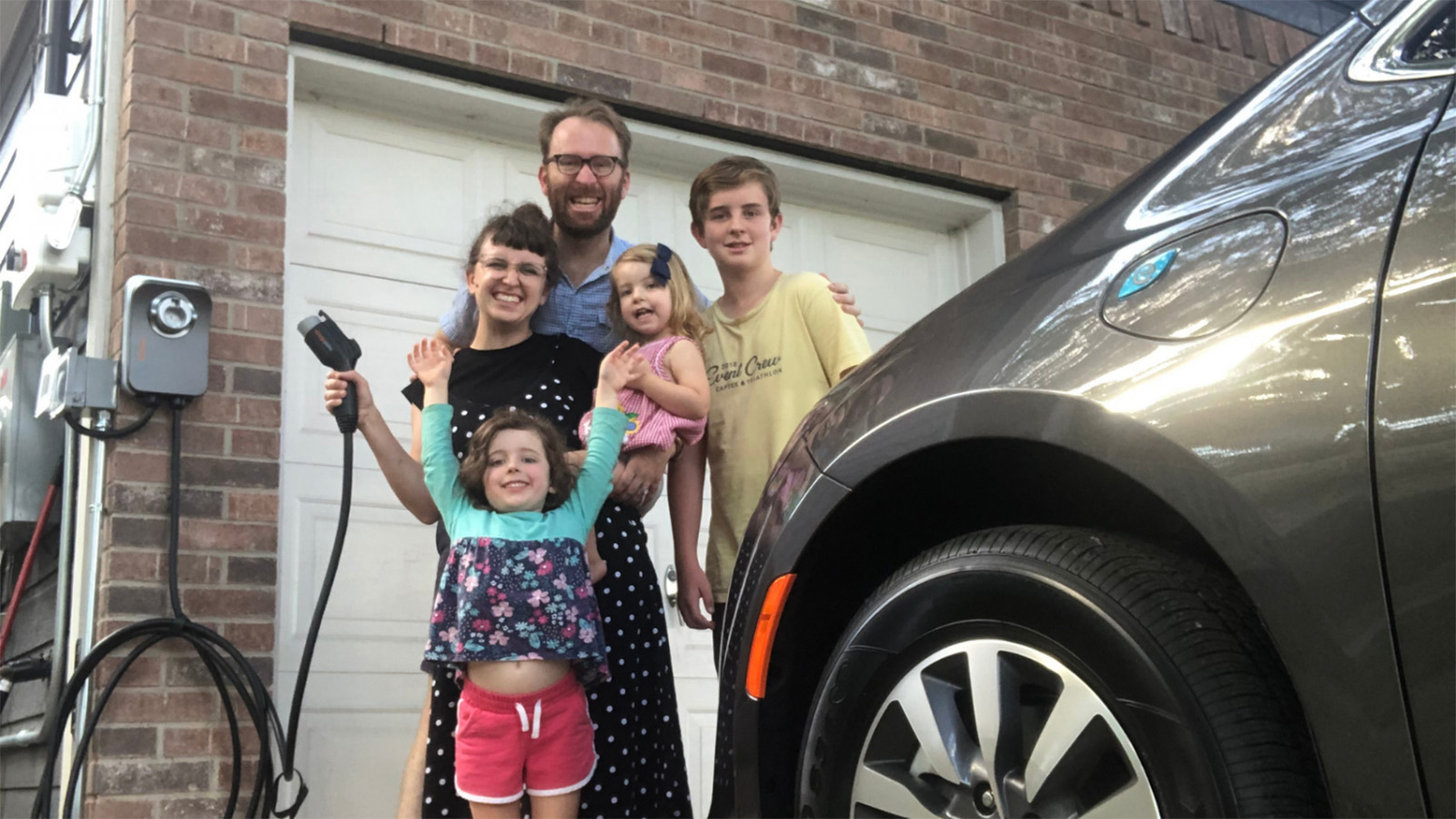 Luke Metzger and family with their EV