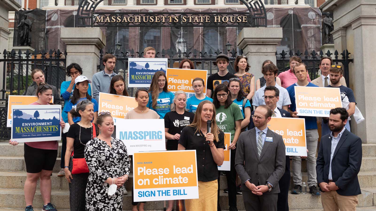 Dozens of staff of Environment America, Environment Massachusetts and MASSPIRG rally for the passage of the climate bill on the steps of the Massachusetts State House.