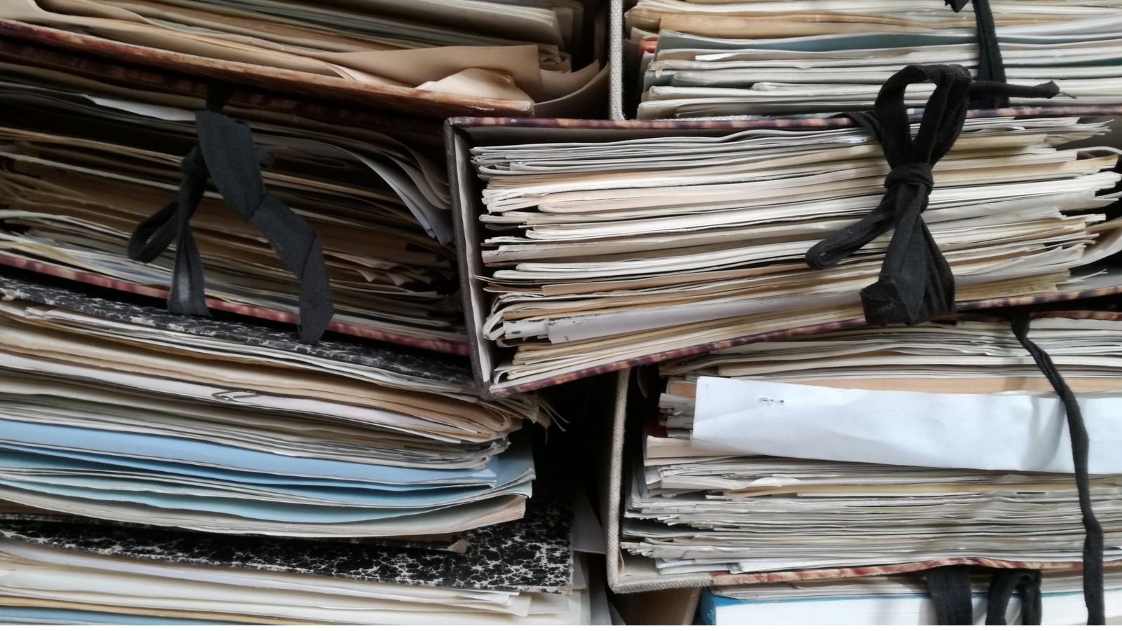 stacks of legal documents in file folders