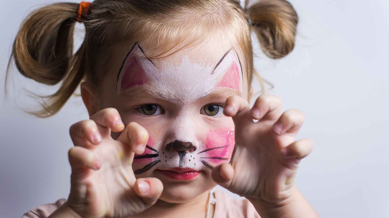 child with cat makeup