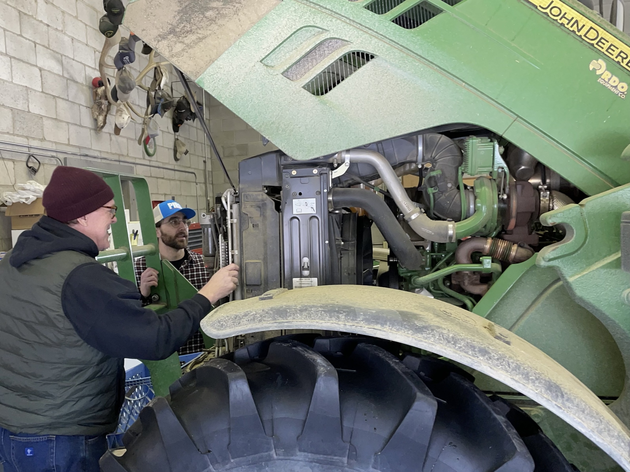 Right to Repair advocates investigate a John Deere tractor.