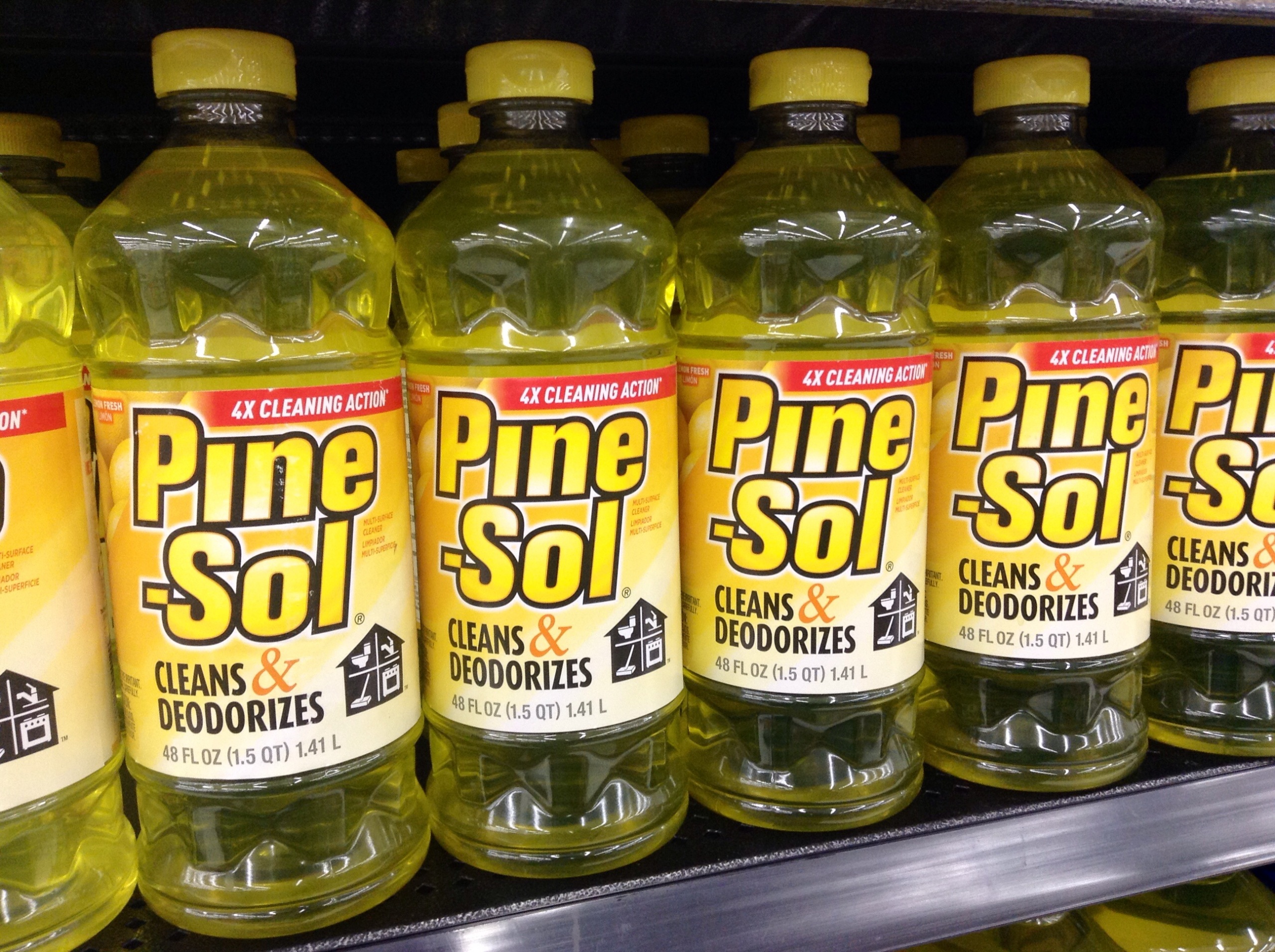 Bottles of Pine-Sol displayed on a store shelf