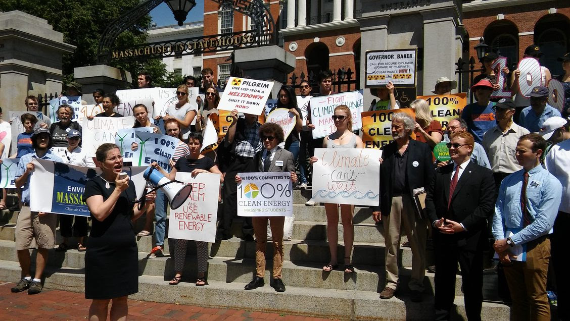 Activists and elected officials rallying in front of the State House in Boston