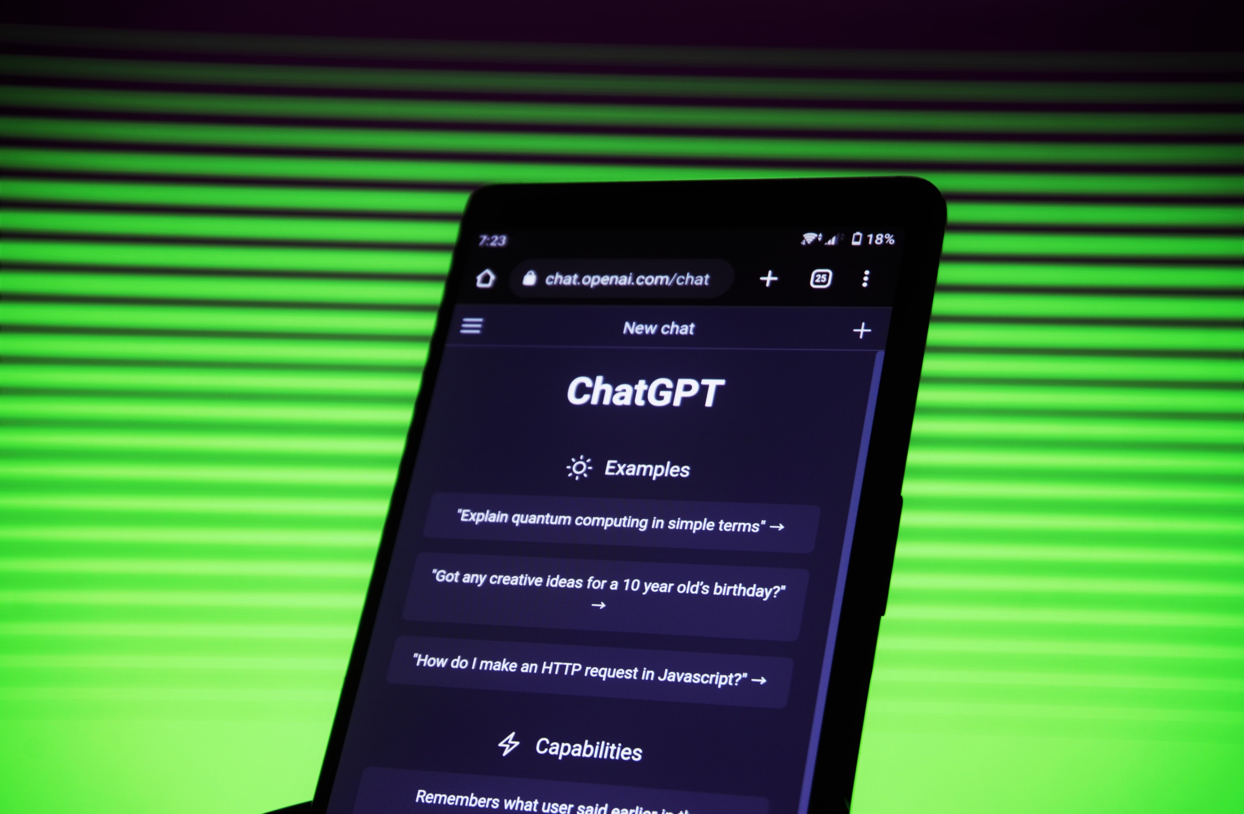 ChatGPT on phone in front of green lined screen