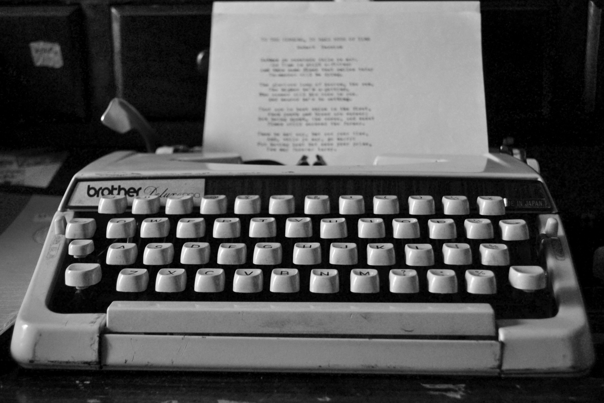 Old Brother typewriter with a blurred letter in it.